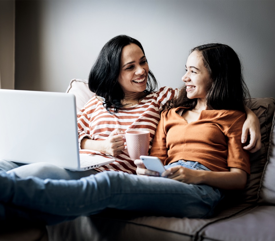 Two people sharing a warm, connected moment at home